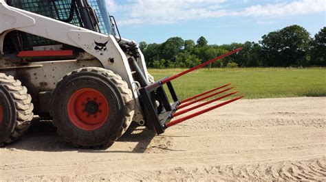 bale forks for skid steer|skid steer round bale spear.